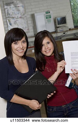 High School Students Holding Document View Large Photo Image Picture - High School Students Holding Document. Fotosearch
