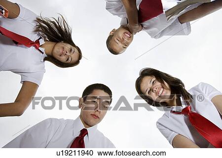 Stock Image - High School Students Looking Down. Fotosearch