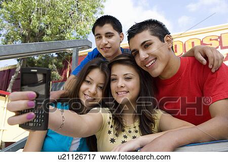 Stock Photo - High School Students Taking a Self Portrait. Fotosearch