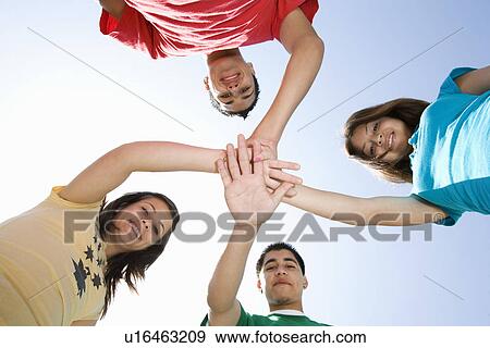 Stock Photo - High School Students Touching Hands. Fotosearch