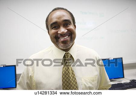 Picture - High School Teacher in Computer Lab. Fotosearch