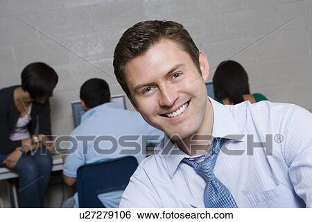 Stock Photograph - High School Teacher in Computer Lab. Fotosearch
