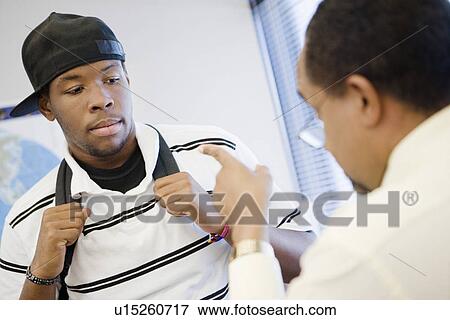 High School Teacher Reprimanding a Student View Large Photo Image Stock Photo - High School Teacher Reprimanding a Student. Fotosearch