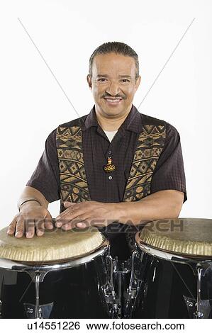 Hispanic bongo drum player View Large Photo Image Stock Photograph - Hispanic bongo drum player. Fotosearch