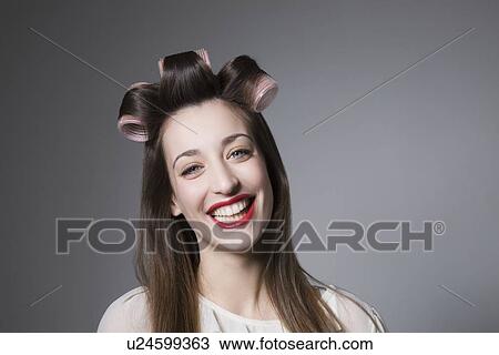 Laughing young woman with hair curlers and red lipstick View Large Photo Image Stock Image - Laughing young woman with hair curlers and red lipstick. Fotosearch