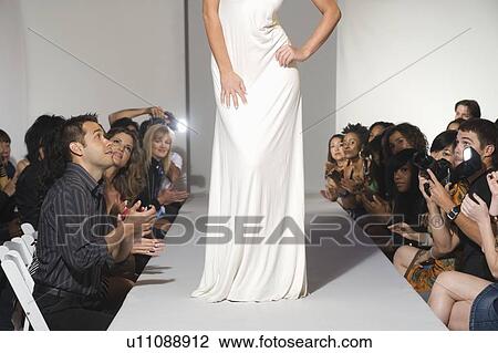 Stock Image - Low section of woman on fashion catwalk. Fotosearch