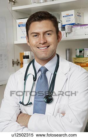 Male doctor in hospital, portrait View Large Photo Image Stock Photography - Male doctor in hospital, portrait. Fotosearch