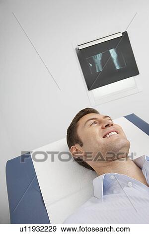 Male patient lying on bed in hospital View Large Photo Image Stock Photo - Male patient lying on bed in hospital. Fotosearch