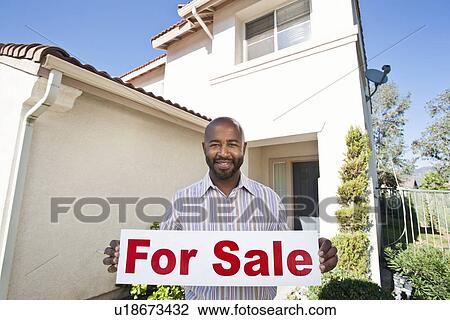 Man holding 'for sale' notice View Large Photo Image Stock Image - Man holding 'for sale' notice. Fotosearch
