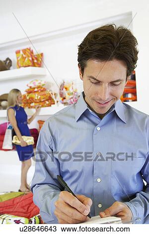 Man Signing a Receipt View Large Photo Image Stock Image - Man Signing a Receipt. Fotosearch