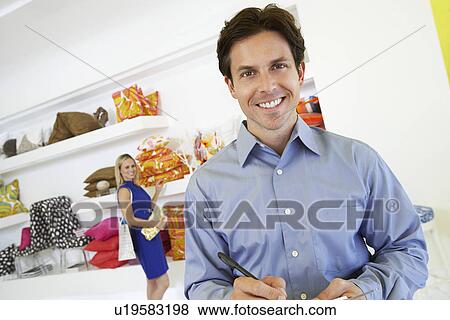Man Signing a Receipt View Large Photo Image Stock Photo - Man Signing a Receipt. Fotosearch