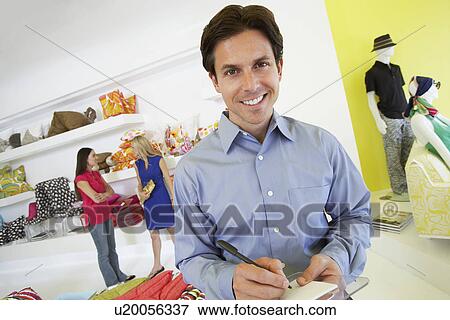 Stock Photo - Man Signing a Receipt. Fotosearch