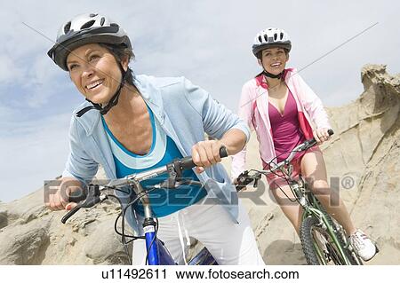 Mature and mid adult women compete on a cycle ride View Large Photo Image Stock Image - Mature and mid adult women compete on a cycle ride. Fotosearch