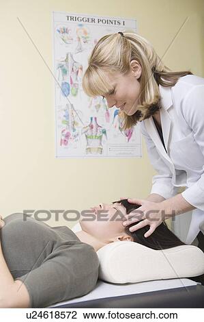 Medical practioner applies pressure to skull View Large Photo Image Stock Image - Medical practioner applies pressure to skull. Fotosearch