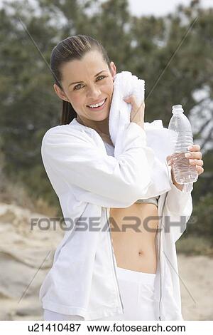 Mid adult woman after exercise View Large Photo Image Stock Photo - Mid adult woman after exercise. Fotosearch
