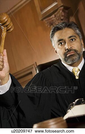 Middle-aged judge forming sentence View Large Photo Image Stock Photo - Middle-aged judge forming sentence. Fotosearch