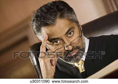 Middle-aged judge in a courtroom View Large Photo Image Stock Image - Middle-aged judge in a courtroom. Fotosearch