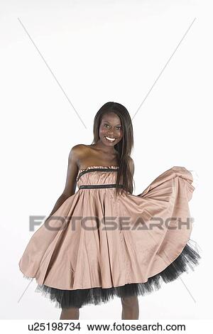 Model stands smiling in pink dress with petticoats View Large Photo Image Picture - Model stands smiling in pink dress with petticoats. Fotosearch