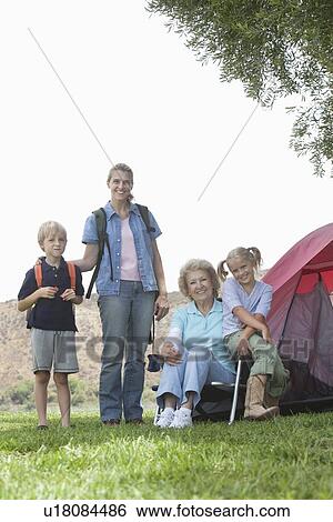 Mother, daughter and grand-children outside tent View Large Photo Image Stock Photograph - Mother, daughter and grand-children outside tent. Fotosearch
