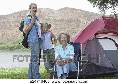 Mother, daughter and grand-daughter outside tent View Large Photo Image Stock Photography - Mother, daughter and grand-daughter outside tent. Fotosearch