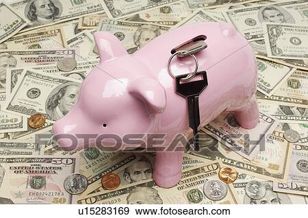 Stock Photo - Piggy Bank on Money. Fotosearch