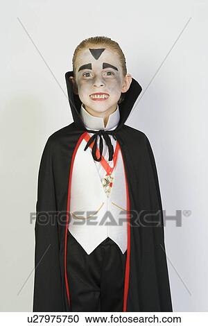 Portrait of boy (7-9) wearing dracula costume for Halloween View Large Photo Image Stock Image - Portrait of boy (7-9) wearing dracula costume for Halloween. Fotosearch