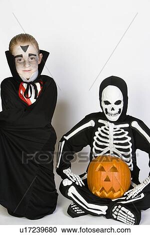 Portrait of boys (7-9) wearing Halloween costumes View Large Photo Image Stock Image - Portrait of boys (7-9) wearing Halloween costumes. Fotosearch