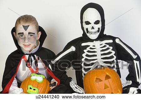 Portrait of boys (7-9) wearing Halloween costumes View Large Photo Image Stock Image - Portrait of boys (7-9) wearing Halloween costumes. Fotosearch