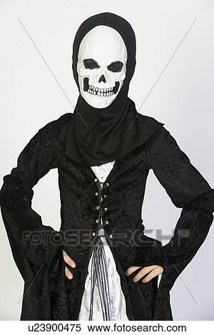 Stock Photography - Portrait of child (7-9) wearing skeleton costume. Fotosearch