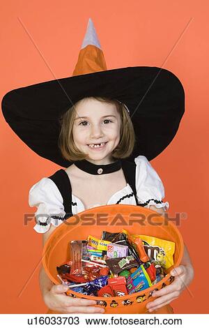 Portrait of girl (7-9) wearing witch costume for Halloween View Large Photo Image Stock Image - Portrait of girl (7-9) wearing witch costume for Halloween. Fotosearch