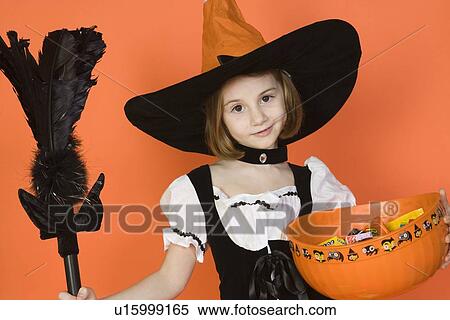 Portrait of girl (7-9) wearing witch costume for Halloween View Large Photo Image Stock Photography - Portrait of girl (7-9) wearing witch costume for Halloween. Fotosearch