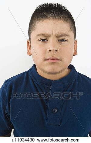 Stock Image - Portrait of pre-teen (10-12) boy. Fotosearch