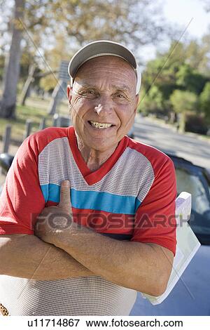 Portrait of senior man holding map View Large Photo Image Stock Photo - Portrait of senior man holding map. Fotosearch