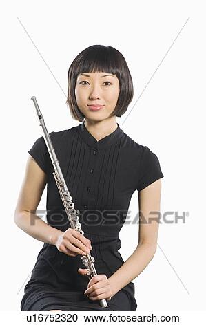 Portrait of young Korean woman holding flute View Large Photo Image Stock Image - Portrait of young Korean woman holding flute. Fotosearch
