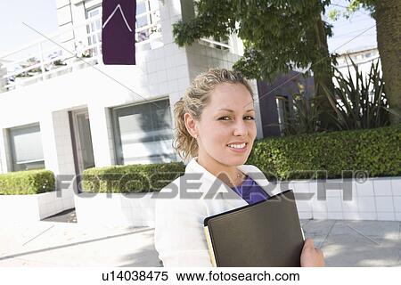 Portrait of young woman outdoors View Large Photo Image Stock Photography - Portrait of young woman outdoors. Fotosearch