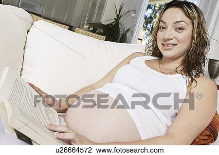 Pregnant woman reading book View Large Photo Image Stock Image - Pregnant woman reading book. Fotosearch