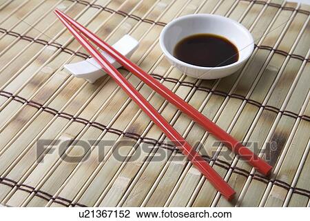 Red chopsticks and side bowl of soy sauce View Large Photo Image Stock Image - Red chopsticks and side bowl of soy sauce. Fotosearch