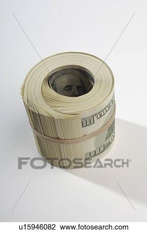Stock Image - Rolled Up Money. Fotosearch