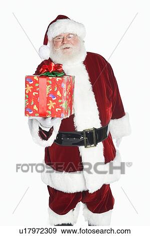 Stock Photo - Santa Claus holding gift. Fotosearch