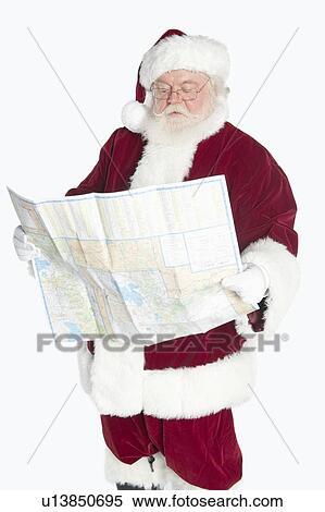 Stock Photography - Santa Claus holding map. Fotosearch