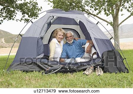 Senior couple at entrance to tent View Large Photo Image Stock Photo - Senior couple at entrance to tent. Fotosearch