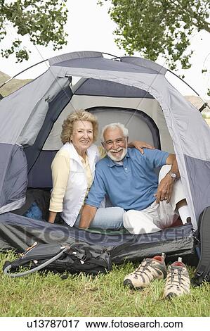 Senior couple at entrance to tent View Large Photo Image Stock Photo - Senior couple at entrance to tent. Fotosearch