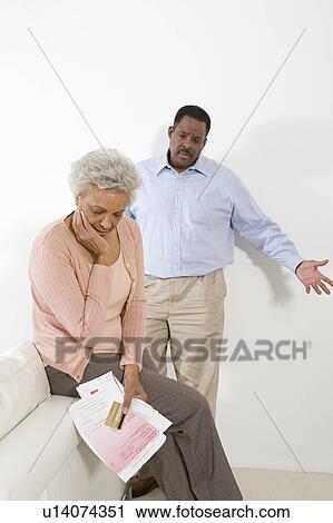 Stock Image - Senior Couple Having Financial Difficulties. Fotosearch