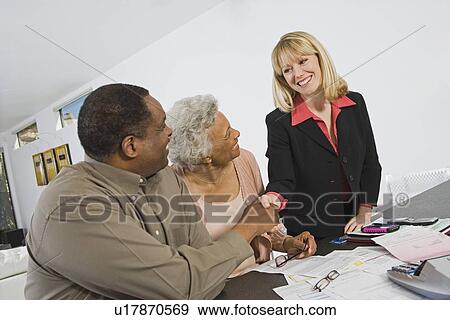 Senior Couple Meeting Financial Advisor View Large Photo Image Stock Photo - Senior Couple Meeting Financial Advisor. Fotosearch