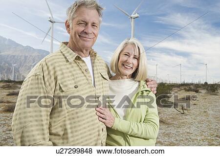 Senior couple near wind farm View Large Photo Image Stock Photo - Senior couple near wind farm. Fotosearch