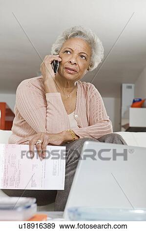 Stock Photo - Senior Couple On The Phone. Fotosearch