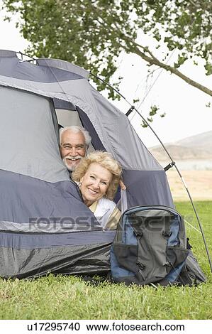 Senior couple with heads at tent flap View Large Photo Image Stock Image - Senior couple with heads at tent flap. Fotosearch