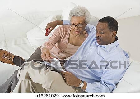Stock Photo - Senior Couple With Paperwork. Fotosearch