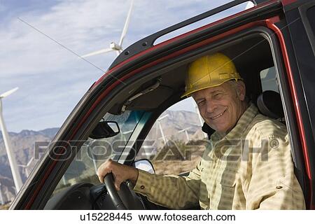Senior man in truck at wind farm View Large Photo Image Stock Photography - Senior man in truck at wind farm. Fotosearch
