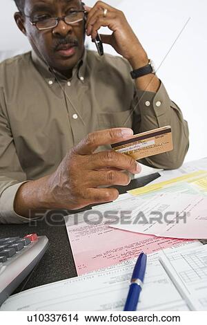 Senior Man On The Phone Holding Credit Card View Large Photo Image Picture - Senior Man On The Phone Holding Credit Card. Fotosearch